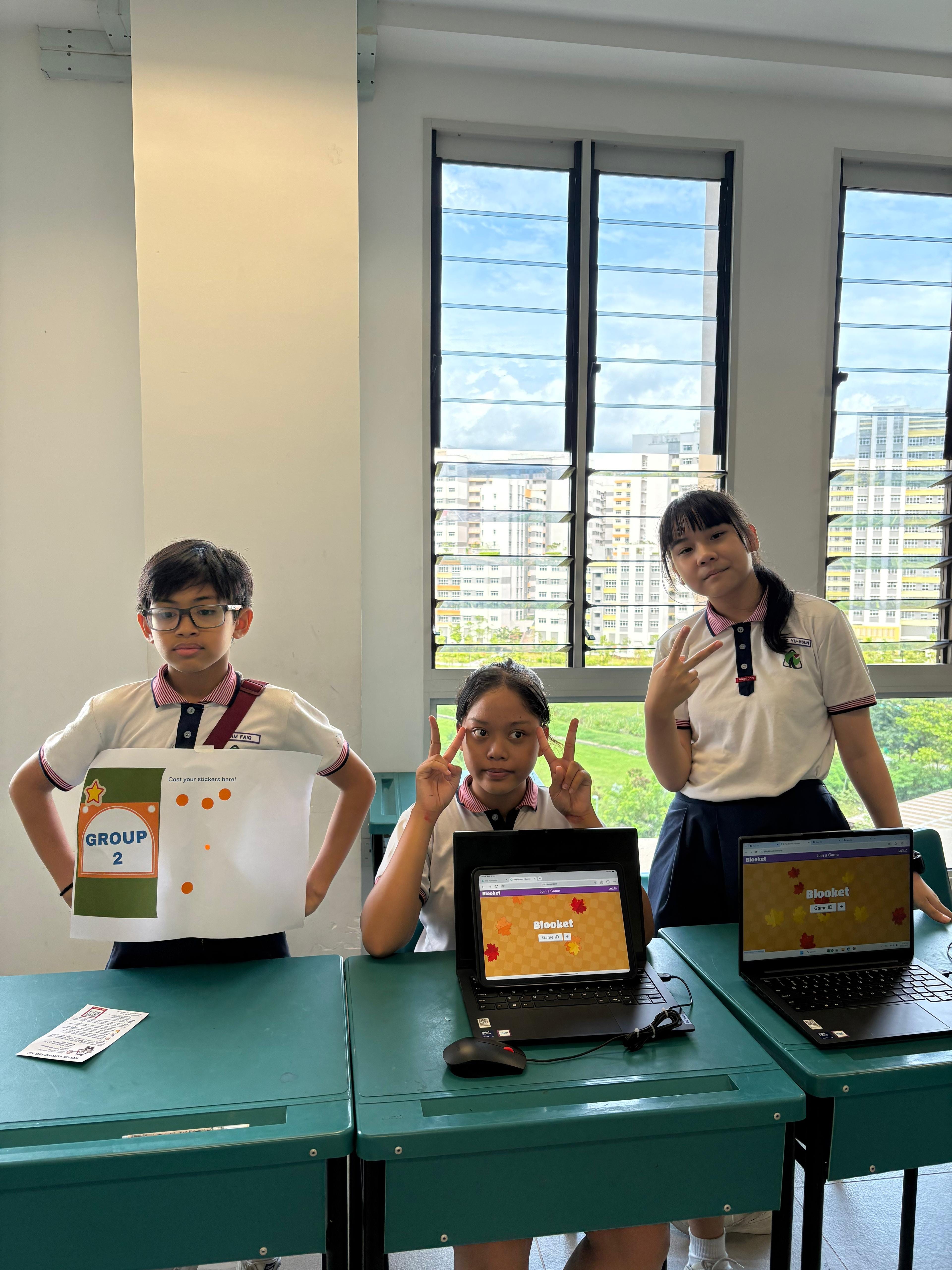 Students presenting their artefacts in front of the class